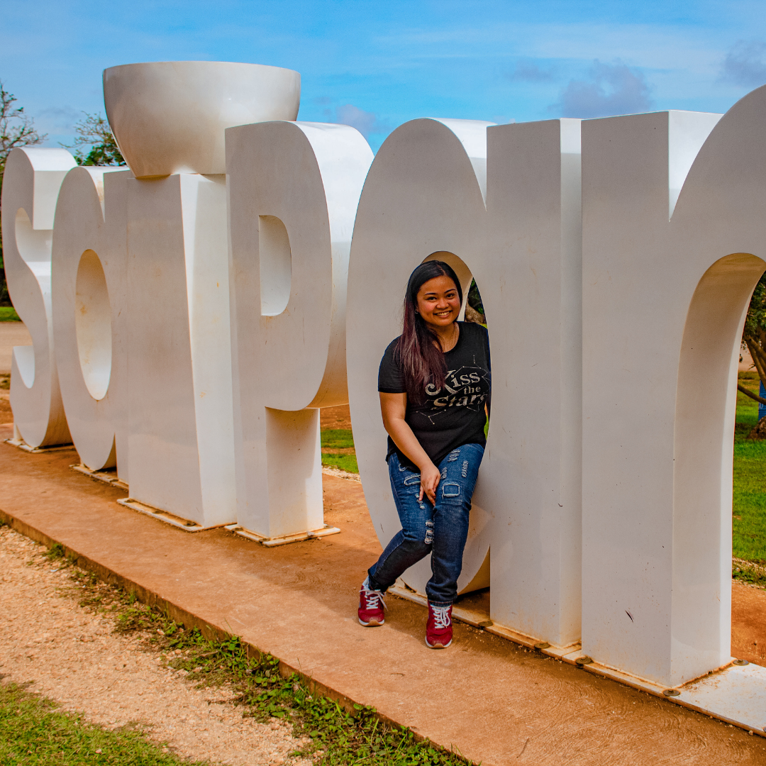 Take a picture at the "Saipan" sign